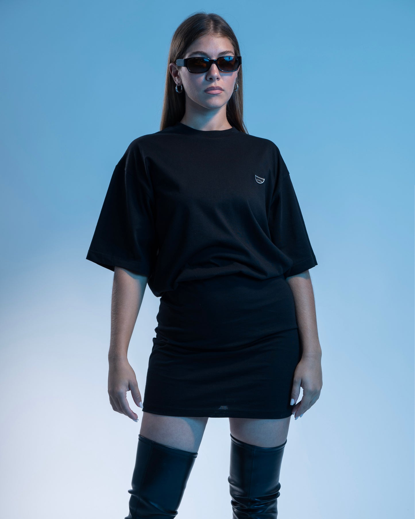 Black mini tee dress with short sleeves and a relaxed fit, perfect for casual wear
